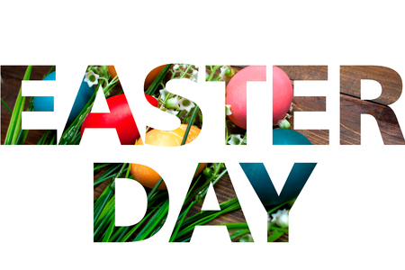 Multi-colored, bright Easter eggs with green, spring lilies of the valley on wooden background white background with transparent test and the inscription Easter Day.の写真素材