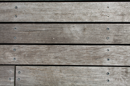 Gray wooden background. Abstract background with nails and joints of boardsの写真素材