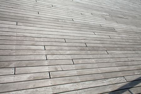 Gray wooden background. Abstract background with nails and joints of boardsの写真素材