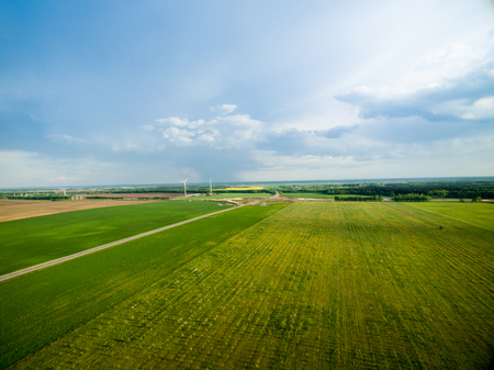 Nature wind stations. Windmills on a beautiful spring day bird's-eye view. Summer landscapeの写真素材