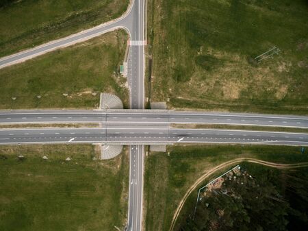 Asphalt highway and bridge road. Top view. Summer landscape. Drone photo.の写真素材
