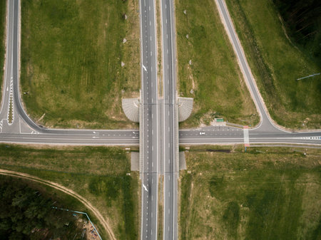 Asphalt highway and bridge road. Top view. Summer landscape. Drone photo.