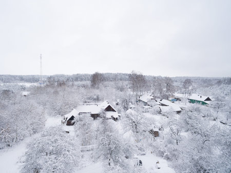 Winter snowy village. Photo of houses top view. Beautiful landscapeの写真素材