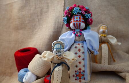 handmade motanka doll on linen fabric backgroundの写真素材