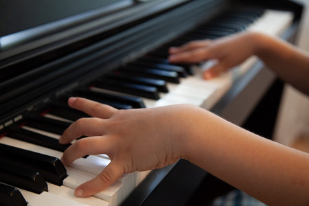 a child learns to play a good piano