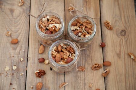 mix of nuts in a jar walnut migdale foxの写真素材