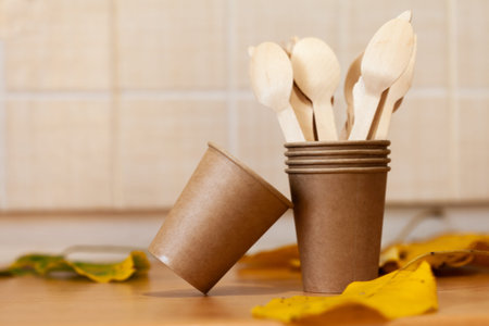 eco paper plate dish fork on old wooden tableの写真素材