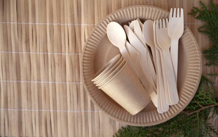 Eco paper utensils with cardboard, paper, wood. On an old wooden table, concept of zero plastic.の写真素材