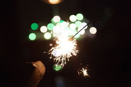 Bengal fire and sparks macro photo festive bokeh background Christmas and New Yearの写真素材