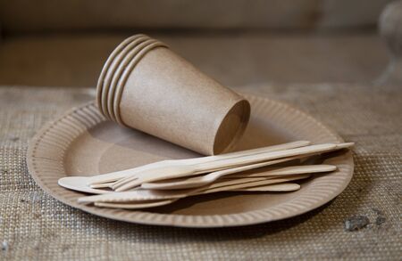 Eco paper utensils with cardboard, paper, wood. On an old wooden table, concept of zero plastic.の写真素材