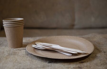 Eco paper utensils with cardboard, paper, wood. On an old wooden table, concept of zero plastic.の写真素材