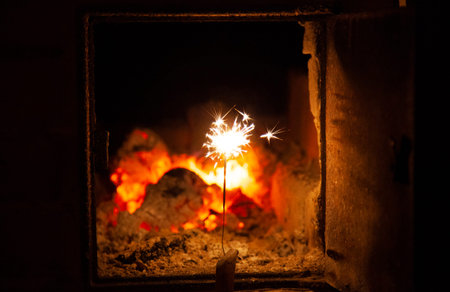 Bengal fire and sparks macro photo festive bokeh background Christmas and New Year