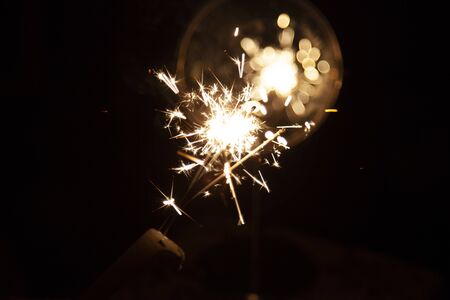 Bengal fire and sparks macro photo festive bokeh background Christmas and New Yearの写真素材