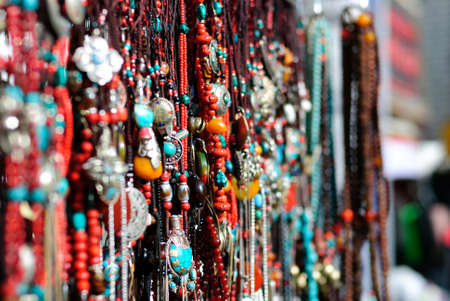 Traditional decoration necklaces in Tibet market place backgroundの写真素材