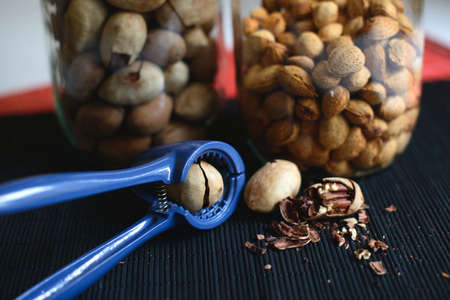 Tasty cracked pecans on the table close upの写真素材