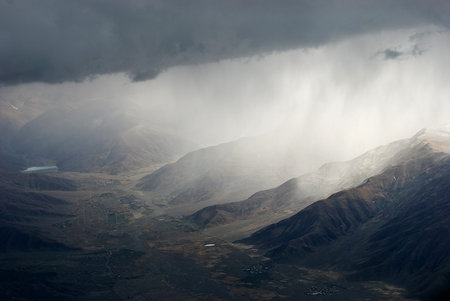 Snowy mountains in clouds in Tibet panorama viewの写真素材