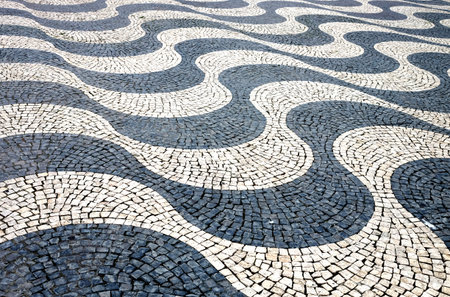 Lisbon wave mosaic cobblestone pavement close up