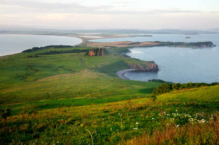 Meadows and harbors view in the sunset backgroundの写真素材