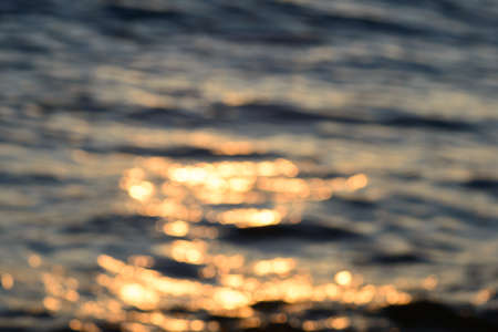 Blurred sea water in the evening light backgroundの写真素材