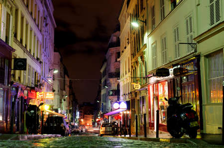 PARIS, FRANCE - 12th of OCTOBER 2012: Shops and historical buildings on Montmartre by night. October 12th, 2012. Paris, France.のeditorial素材