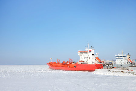 Red expedition ship in the ice