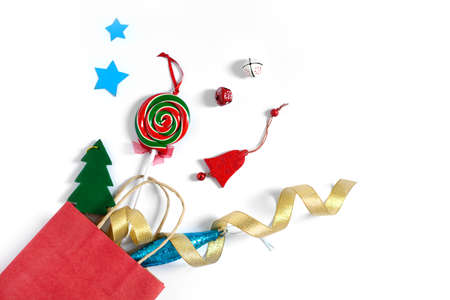 Christmas gifts falling from the red shopping bag, holiday presents isolated on white background, free copy space.の写真素材