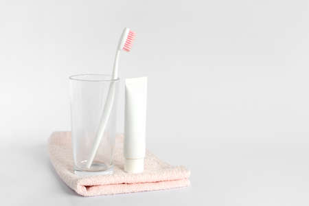 Toothbrushe and toothpaste rinse and towel on white background. Dental and healthcare concept. Free copy space.の写真素材