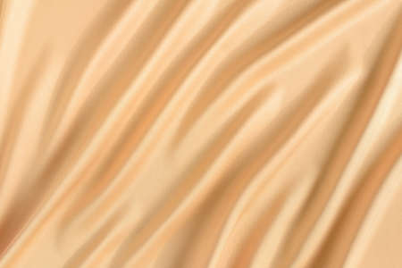 Close up of ripples in gold colored silk fabric. Satin textile background. Free copy space.の写真素材