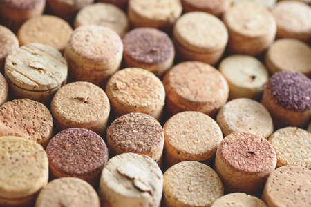 Pile of assorted used wine corks background. Close up top view.の写真素材