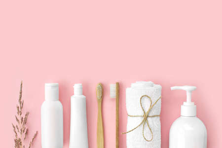 Set of eco-friendly toothbrushes, toothpaste and other tools on pink background. Dental and healthcare concept. Top view, flat lay, free copy space.の写真素材
