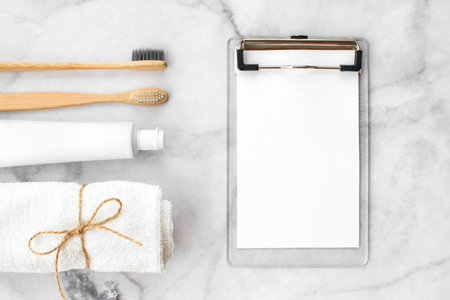 Set of eco-friendly toothbrushes, toothpaste and note free copy space and marble background. Dental and healthcare concept. Top view, flat lay.の写真素材