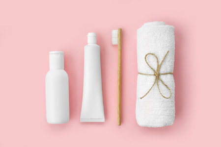 Set of eco-friendly toothbrushes, toothpaste and other tools on pink background. Dental and healthcare concept. Top view, flat lay.の写真素材