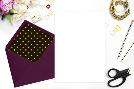Mouck up product template. Flat lay, wedding invitation blank. Woman modern scene, feminine background. Table view up.Glamour style.The workspace on the desk, envelope, scissors, Bracelet with flowersの写真素材