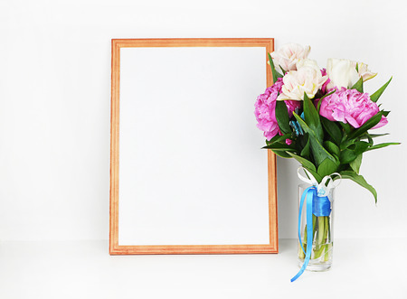 Wood picture frame with decorations. Mock up for your photo or text Place your work, print art. Peonies in vase.の写真素材