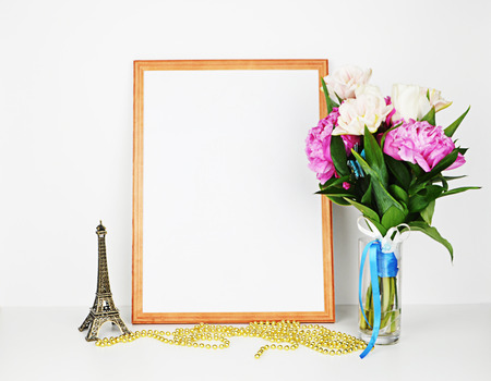 Wood picture frame with decorations. Mock up for your photo or text Place your work, print art. Peonies in vase.の写真素材