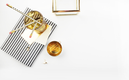 Header website or Hero website, view table gold accessories office items. Flat lay. Feminine workspaceの写真素材