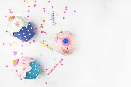 White background with party accessories. Invitation mockup. Confetti and muffins. cakeの写真素材