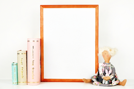 gold picture frame with decorations. Mock up for your photo or text Place your work, print art,shabby style, white background, pastel color bookの写真素材