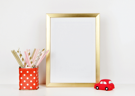Gold frame mock up and toy red car, vase red and polka dots pattern. vintageの写真素材