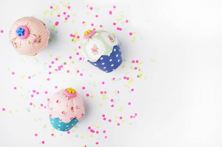 White background with party accessories. Invitation mockup. Confetti and muffins. cakeの写真素材