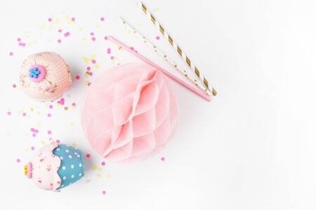 White background with party accessories. Invitation mockup. Confetti and muffins. cakeの写真素材