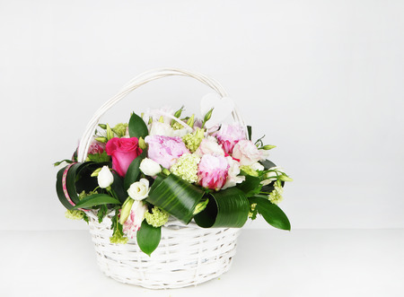 Basket with flowers, white background, peonies, rose, flowersの写真素材