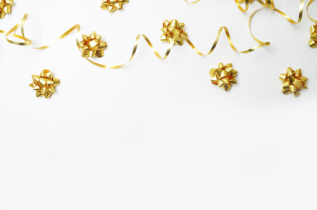 Top view. White background with gold decoration. Gold ribbon. Flat lay. Party mockupの写真素材