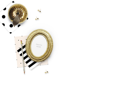 Gold Frame mock-up.Table view woman items, white background , woman desk. Flat lay. Still lifeの写真素材