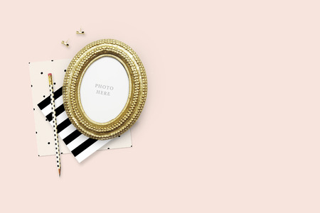 Gold Frame mock-up.Table view woman items, white background , woman desk. Flat lay. Still lifeの写真素材