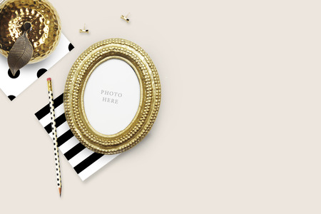 Gold Frame mock-up.Table view woman items, white background , woman desk. Flat lay. Still lifeの写真素材
