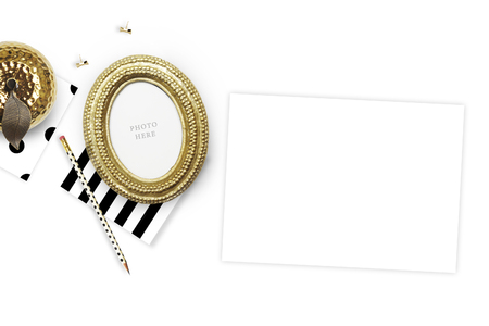 Table view woman items, white background mock up, woman desk. Flat lay. Still life. Gold Frame. Mock-up.の写真素材