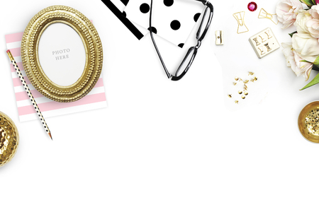 Table view woman items, white background mock up, woman desk. Flat lay. Still life. Gold Frame. Mock-up.の写真素材