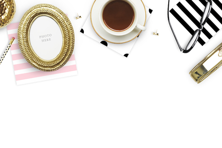 Table view woman items, white background mock up, woman desk. Flat lay. Still life. Gold Frame. Mock-up.の写真素材