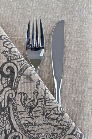 Knife and Fork on linen with French vintage designの写真素材